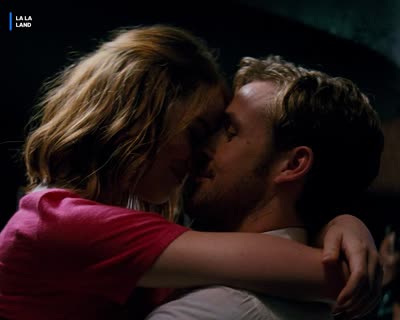 Two people facing each other in an embrace, bug reading LA LA LAND